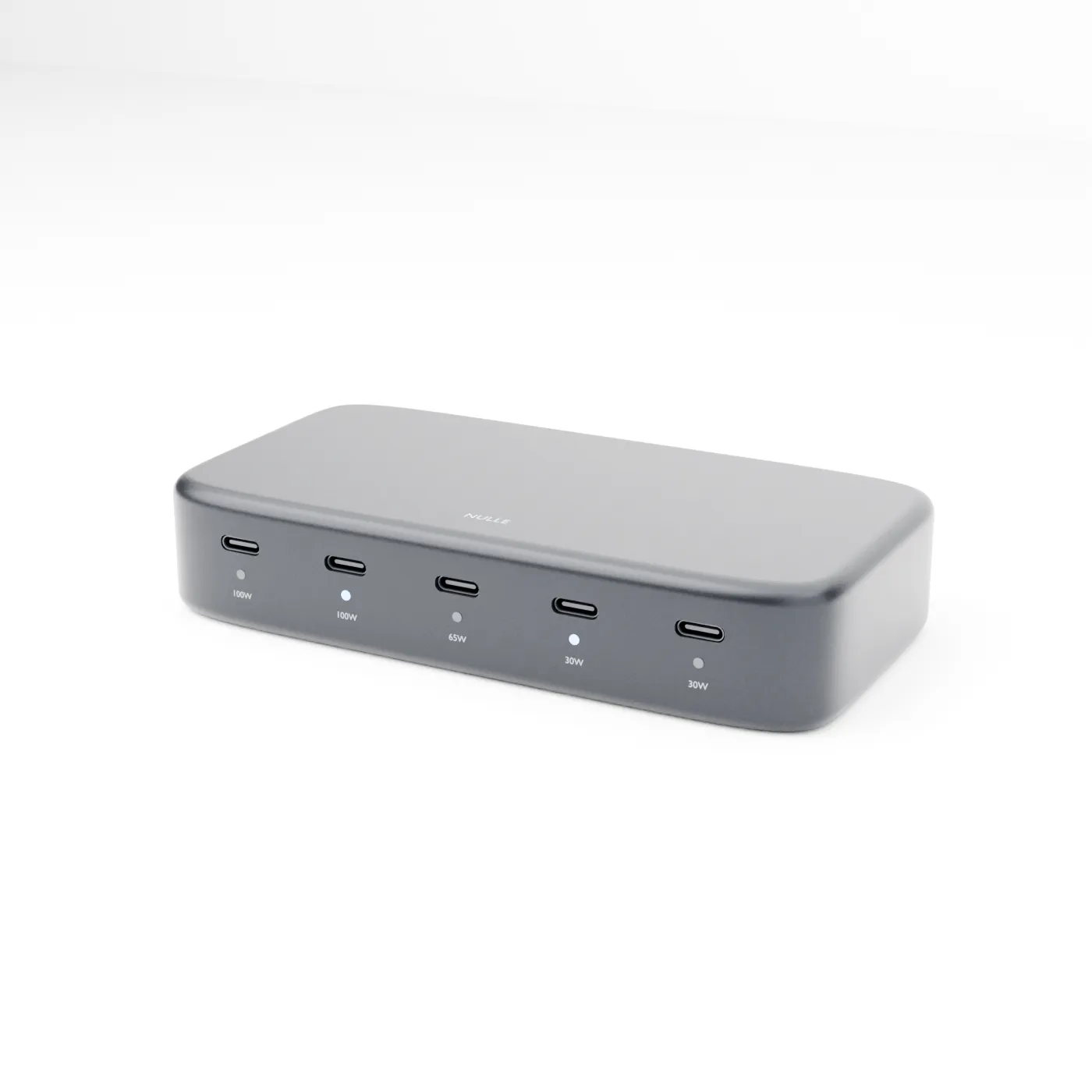 Front detail of the NULLE USB-C hub showing two 100W ports, one 65W port, two 30W ports, and individual indicators.